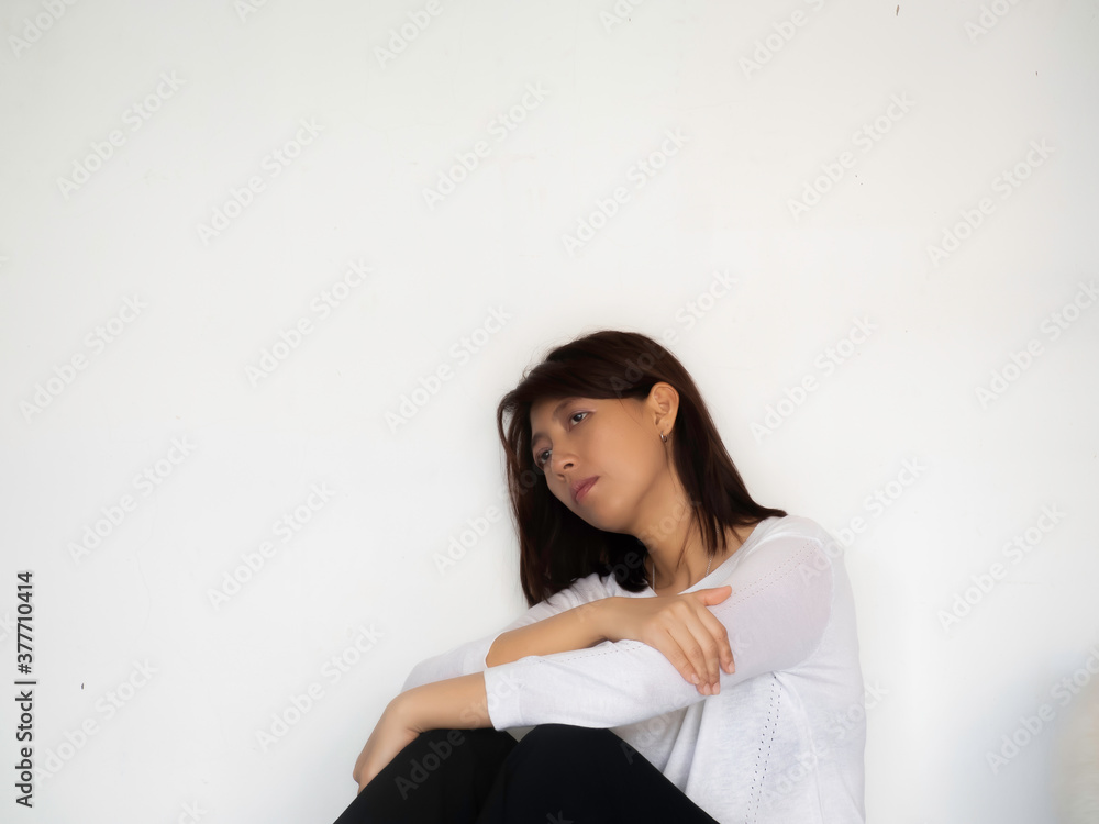 Stressed Woman leaning against to wall,be inattentive,unhappy emotion Stressed Woman leaning against to wall,be inattentive,unhappy emotion