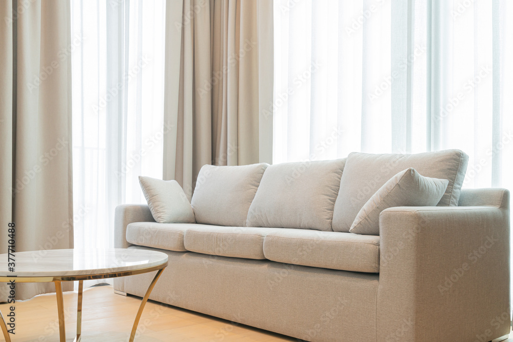 close up light beige fabric sofa with warm cozy morning light from big  window home interior background Stock Photo | Adobe Stock