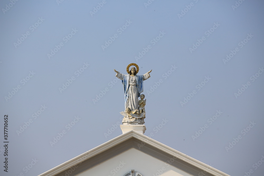 statue of jesus on the top of church in thailand