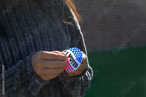 Close up of woman peeling I voted Sticker