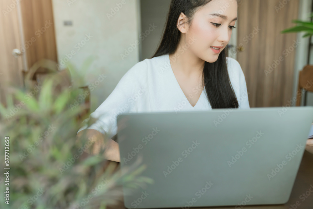 Asian young mother working at home using computer for working from distance whilestay quarantine together with family new normal lifestyle work from home Due to Covid19 virus spread epidemic Asian young mother working at home using computer for working from distance whilestay quarantine together with family new normal lifestyle work from home Due to Covid19 virus spread epidemic