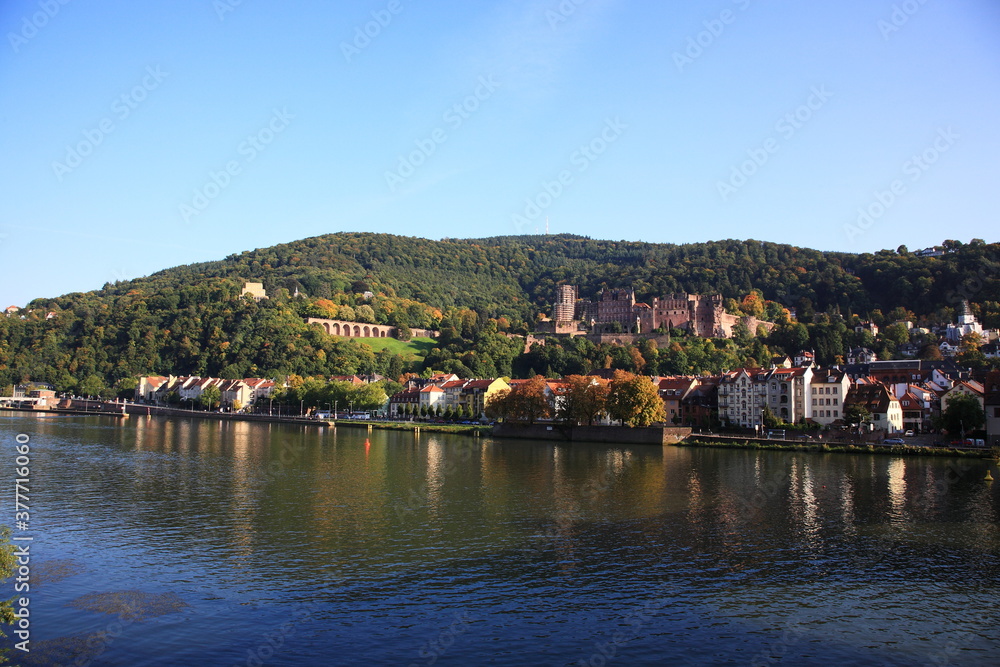 View of Heidelberg old town and Castle with the river Neckar during sunset in autumn in Heidelberg, Germany