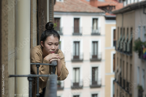 dramatic portrait of young beautiful sad and depressed Asian Japanese woman feeling unhappy and worried suffering some problem going through depression