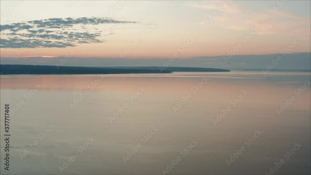 Panoramic shot of forest lake at sunset. Beautiful dawn shot on a lake in Russia Panoramic shot of forest lake at sunset. Beautiful dawn shot on a lake in Russia