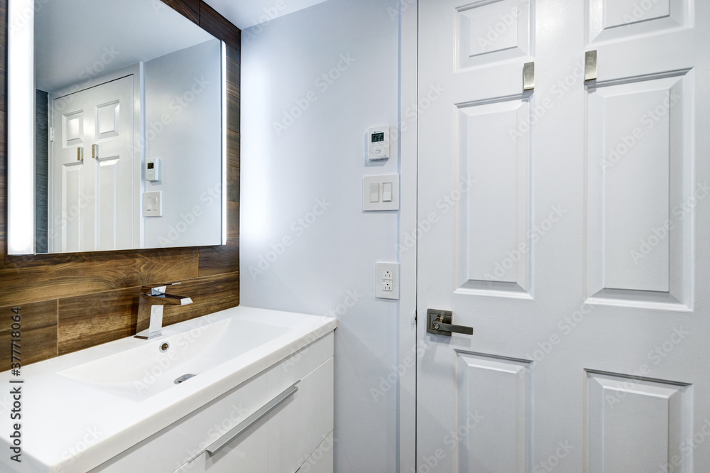 Real estate photography - Beautiful empty renovated apartment in an apartment building with bathroom, new kitchen, new floors, all white painted Real estate photography - Beautiful empty renovated apartment in an apartment building with bathroom, new kitchen, new floors, all white painted