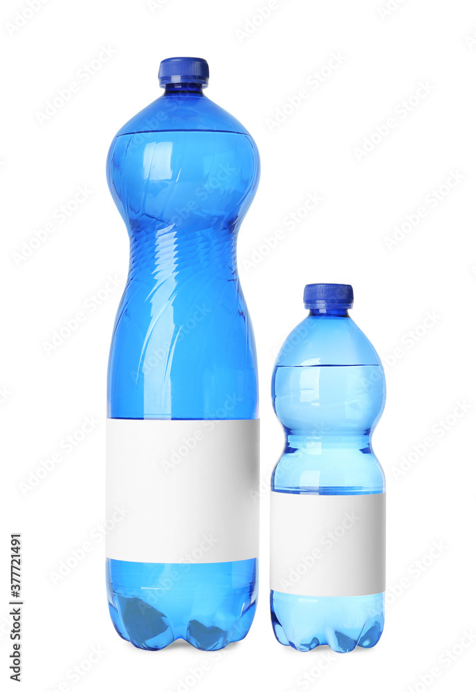 Bottles of pure water with blank labels on white background