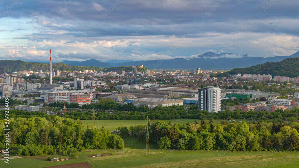 AERIAL: Flying towards industrial-residential neighborhood of Šiška, Ljubljana.