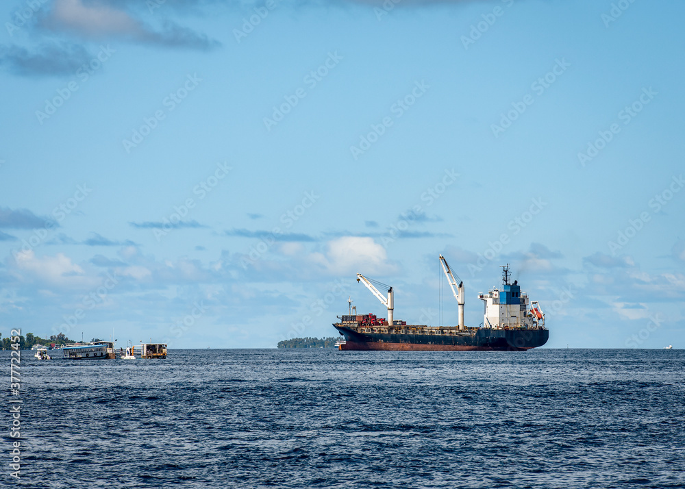 A container ship near the Maldives in the Indian ocean