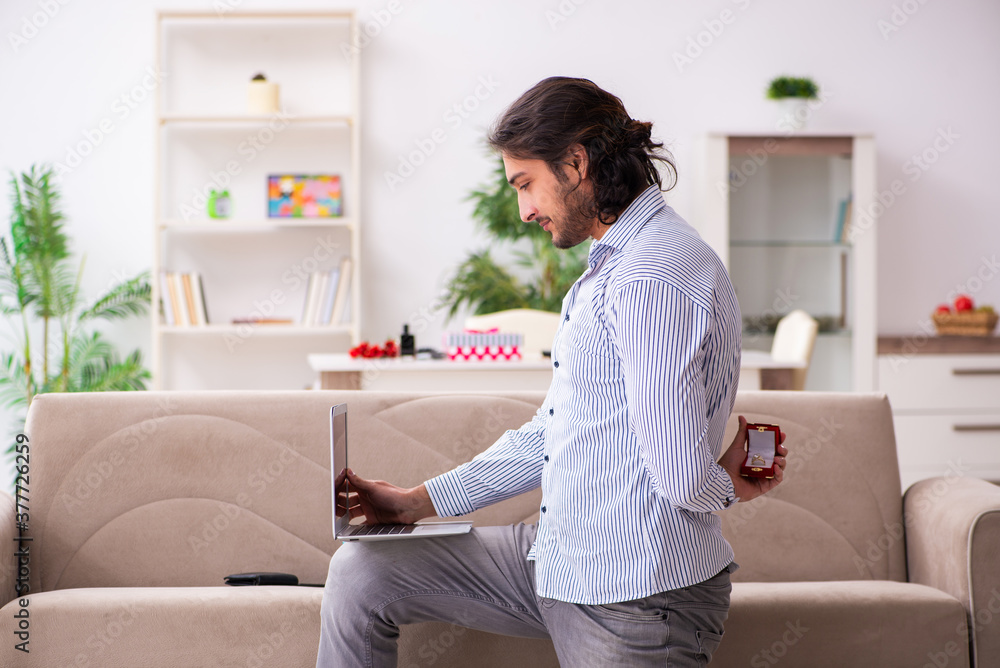 Young man doing marriage proposal via internet Young man doing marriage proposal via internet