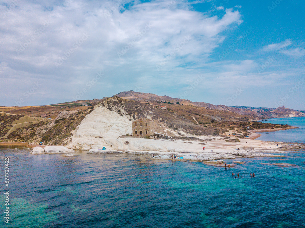 Punta Bianca, Agrigento in Sicily Italy - White beach with old ruins of abandoned stone house on white cliffs