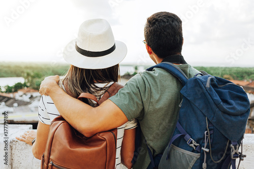 Happy tourist couple talking and having fun on the trip. Concept of travel and love in Latin America