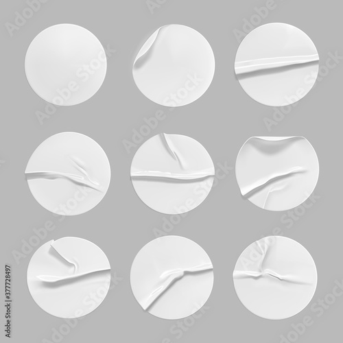 White round crumpled sticker mock up set. Adhesive clear white paper or plastic sticker label with glued, wrinkled effect on gray background. Blank templates label or price tags. 3d realistic vector