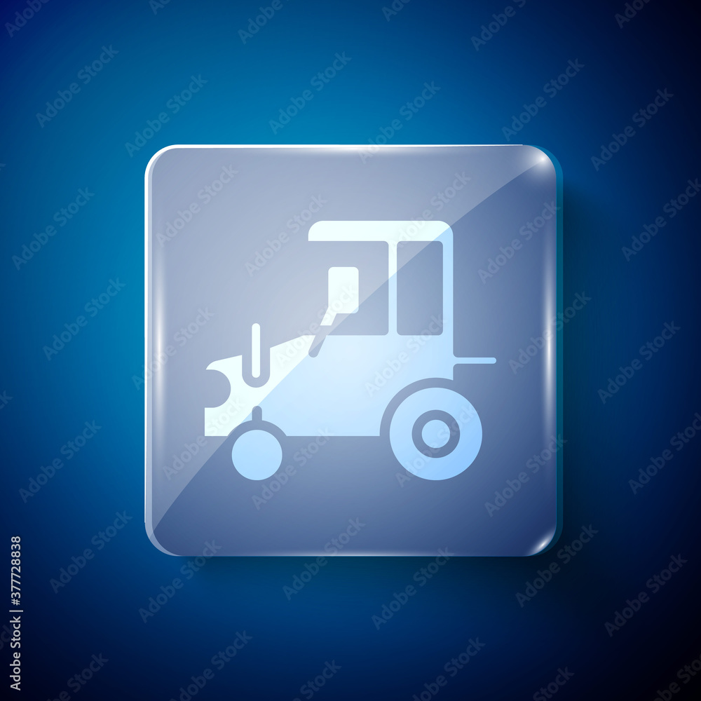 White Tractor icon isolated on blue background. Square glass panels. Vector.