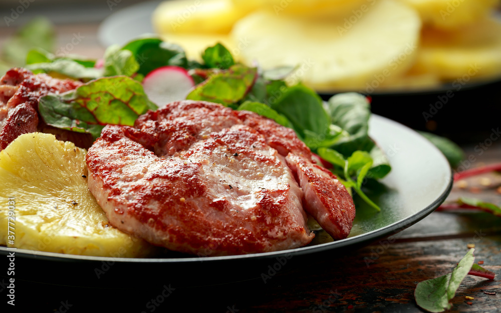 Fried Gammon steak with pineapple, french fries and vegetables Fried Gammon steak with pineapple, french fries and vegetables