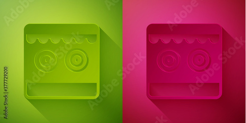 Paper cut Shooting gallery icon isolated on green and pink background. Paper art style. Vector.