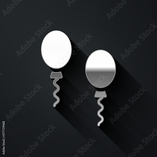 Silver Balloons with ribbons icon isolated on black background. Long shadow style. Vector.