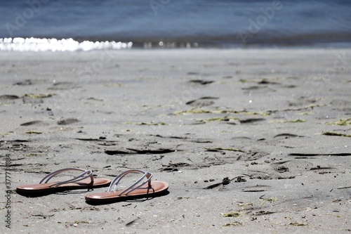 Sandals on Beach Sand