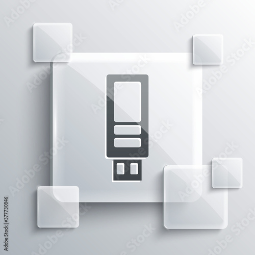 Grey USB flash drive icon isolated on grey background. Square glass panels. Vector.