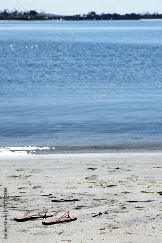 Sandals on Beach Sand