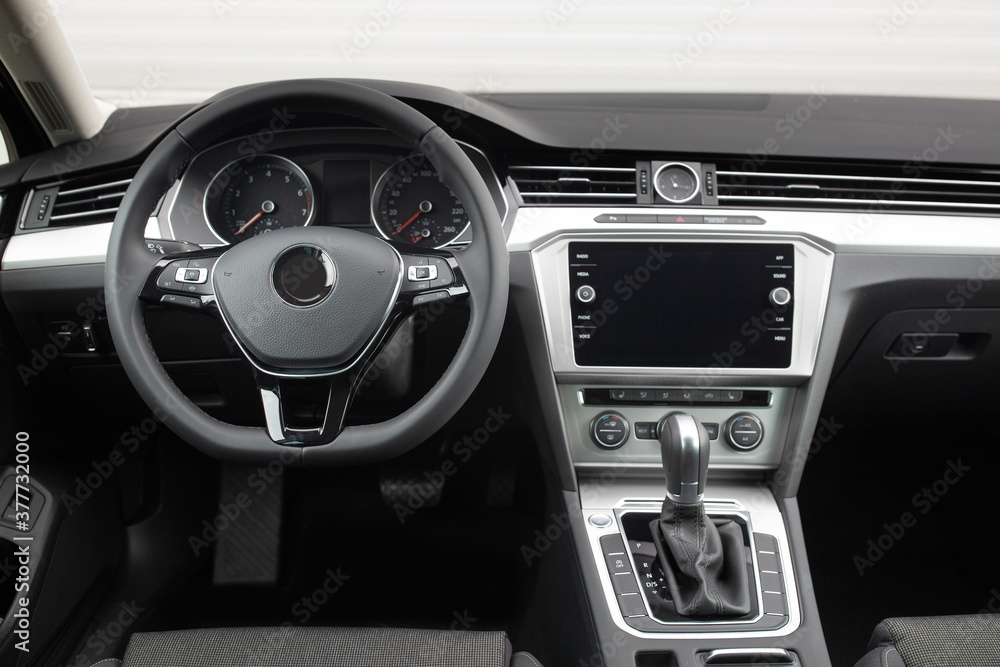 Modern suv car interior with leather panel, multimedia and dashboard