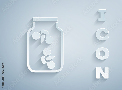 Paper cut Fireflies bugs in a jar icon isolated on grey background. Paper art style. Vector.
