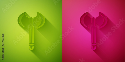 Paper cut Medieval axe icon isolated on green and pink background. Battle axe, executioner axe. Medieval weapon. Paper art style. Vector.