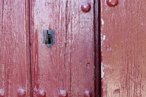 Red antique rustic door keyhole