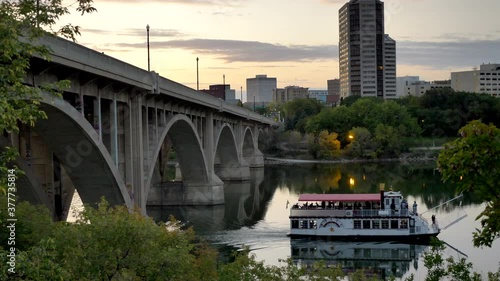 River Boat cruising down Saskatoon River in Saskatoon, SK, Canada photo