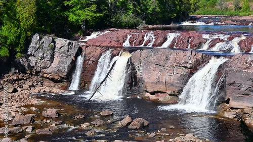 Lepreau Falls in New Brunswick. The water level is very low and the falls a trickle compared to normal. Much of the river bed is visible. photo