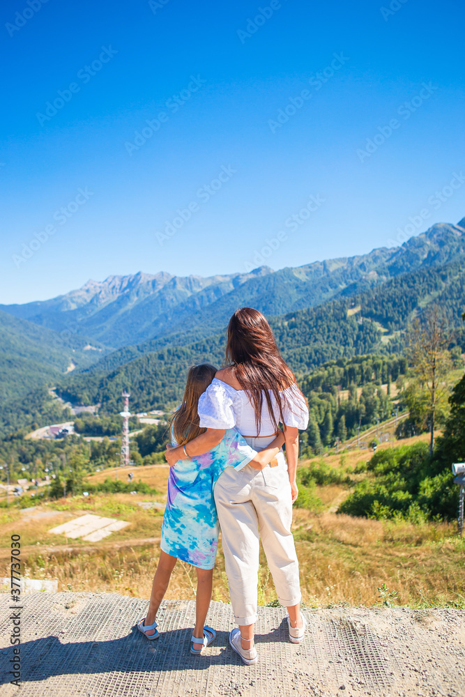 Beautiful happy family in mountains in the background of fog. Beautful landscape