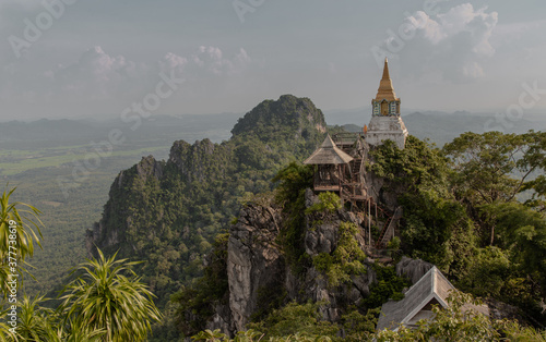 Lampang, Thailand - Sep 03, 2020 : Pagoda on top of the cliff high mountain at Chaloem Phrakiat Phrachomklao Rachanuson temple (Wat Phrabat Pu Pha Daeng) Chae-Hom District, Lampang province, Unseen an
