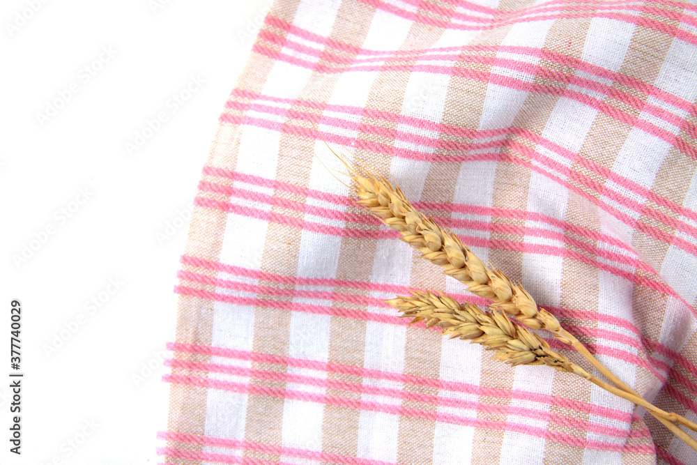 ears of wheat on white and red towel on white background flat lay ears of wheat on white and red towel on white background flat lay