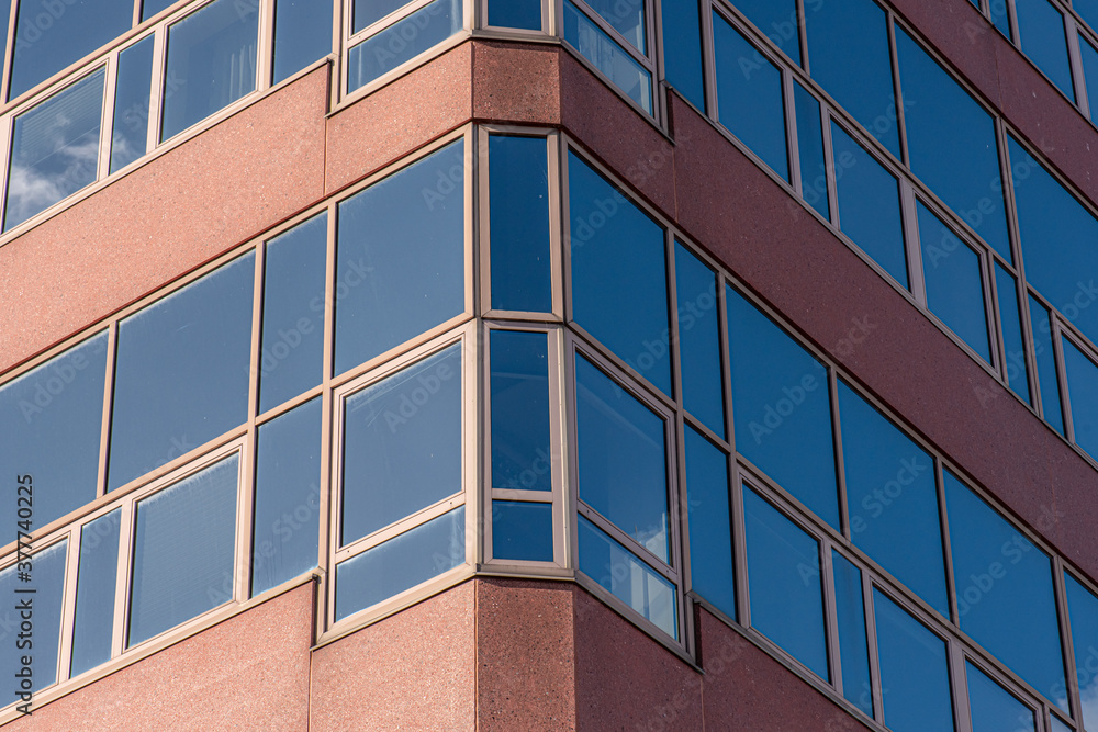 Glass facade of an abandoned office complex. Glass facade of an abandoned office complex.