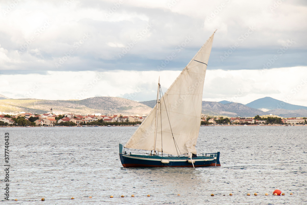 One sail boat in the see