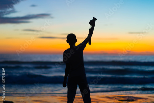 silhouette of a photographer with a camera