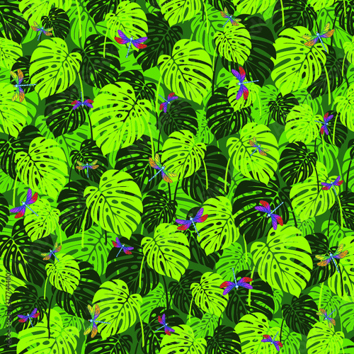 Tropical Monstera leaves seamless pattern with dragonfly.