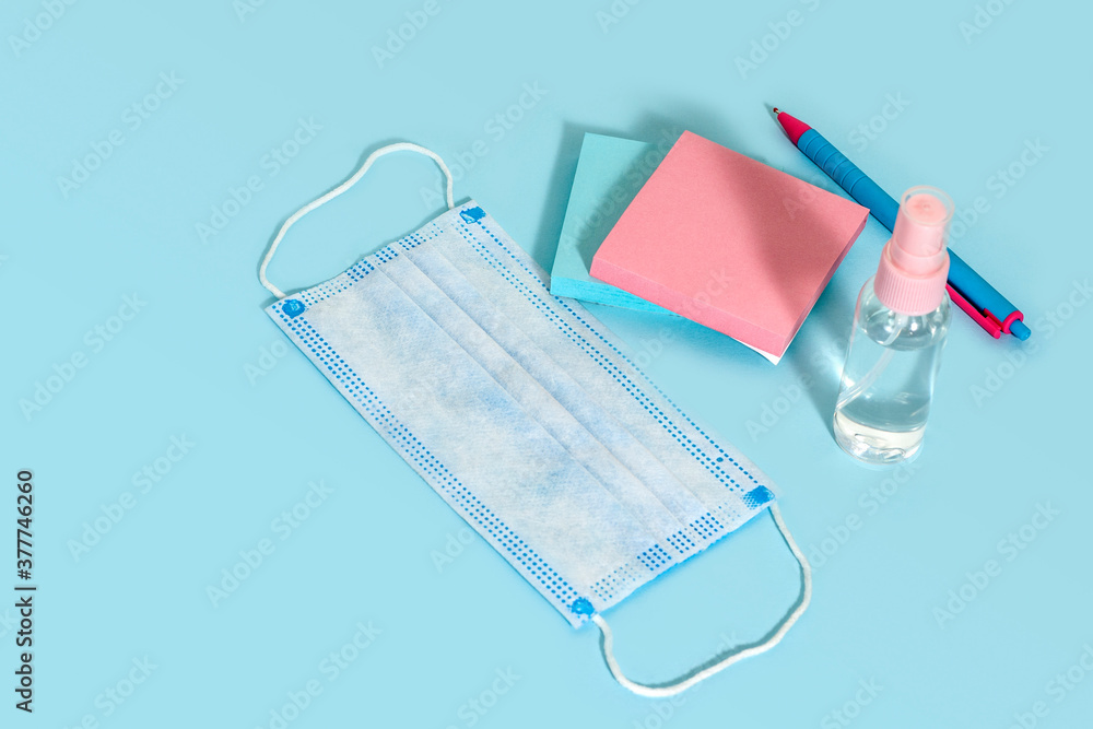 School stationery and medical masks on desk, keep your distance, open school, go back to school for the coronavirus pandemic after being infected 19 School stationery and medical masks on desk, keep your distance, open school, go back to school for the coronavirus pandemic after being infected 19