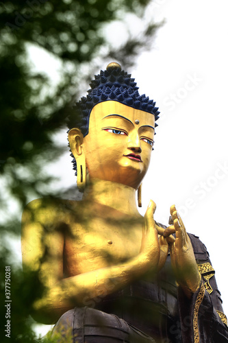 Buddha Park of Ravangla. Beautiful huge statue of Lord Buddha, at Rabangla, Sikkim, India. Gautam Buddha statue in the Buddha Park of Ravangla in South Sikkim. Frame within a frame concept. photo