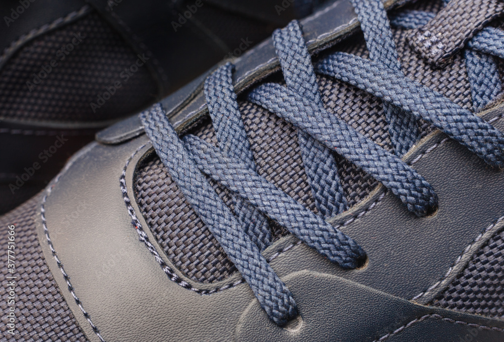 Fragment of blue shoes or sneakers laces. closeup view. Fragment of blue shoes or sneakers laces. closeup view.