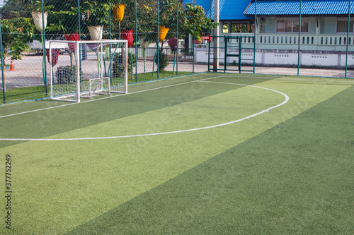 Obraz na płótnie Soccer field with artificial turf in a stadium w salonie