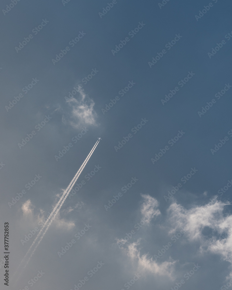 Vapour trail above Warwickshire in blue skies Vapour trail above Warwickshire in blue skies