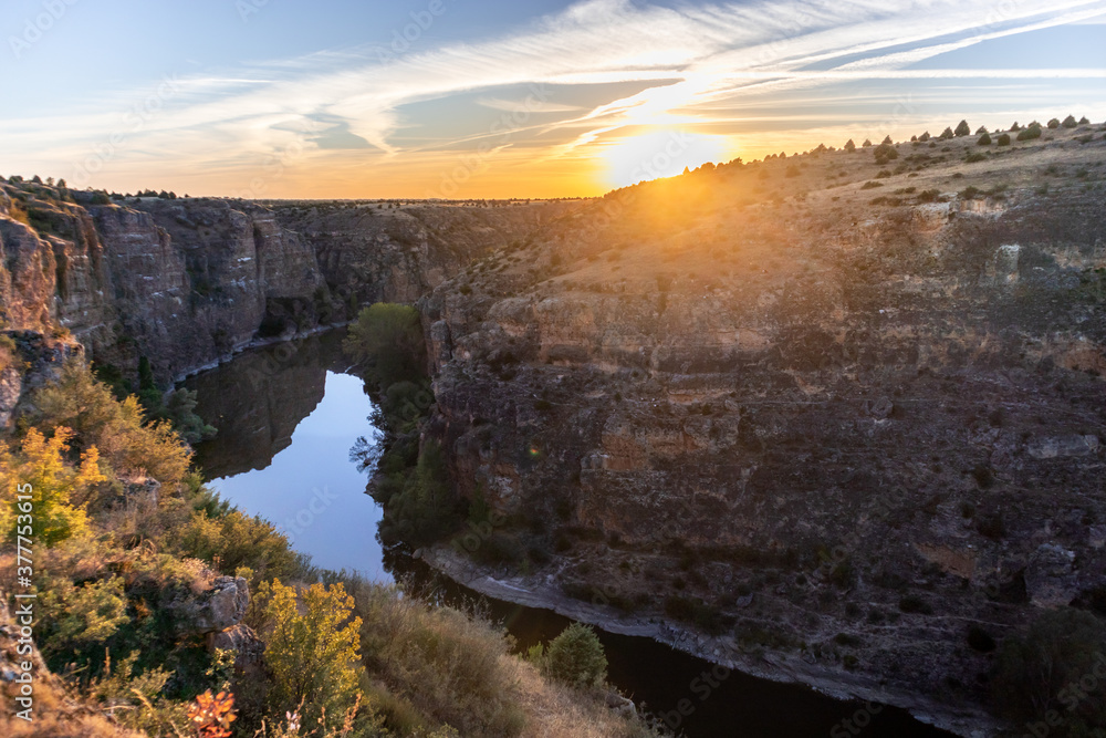 River Duraton at sunset time. River meander among cliffs, close to Convento de la Hoz. Home of the griffon vultures. Hoces del Duratón (Duraton gorges), Segovia, close to capital city Madrid, Spain