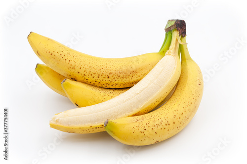 Spotted bananas. Ripened Cavendish bananas isolated on white with shadows.