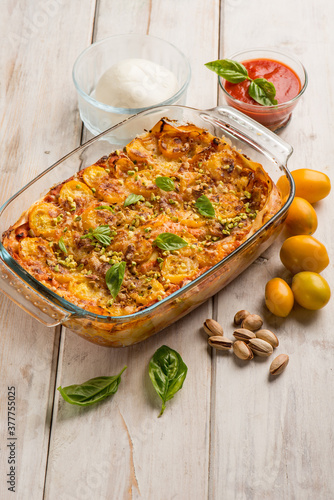 lasagne with mozzarella fresh tomatoes and pistachio nuts