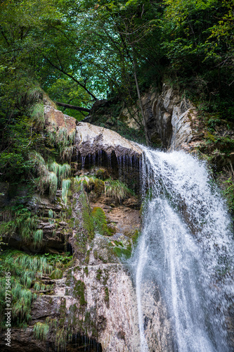 small mountain waterfall in the alps