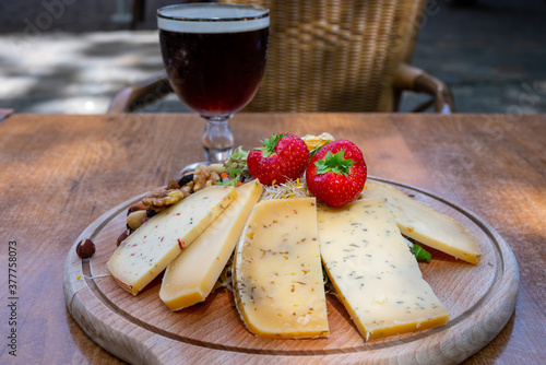 Tasting of different Belgian cheeses and dark strong Belgian beer served outdoor
