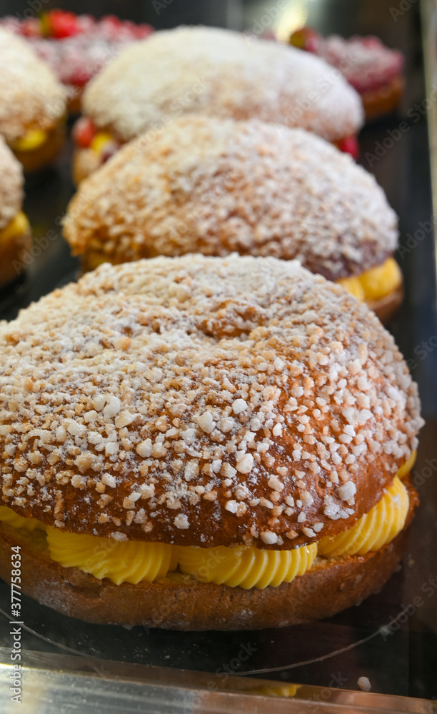 French fresh baked sweet filled brioche pastry tarte tropezienne in confectionery shop in Saint-Tropez, Provence, France
