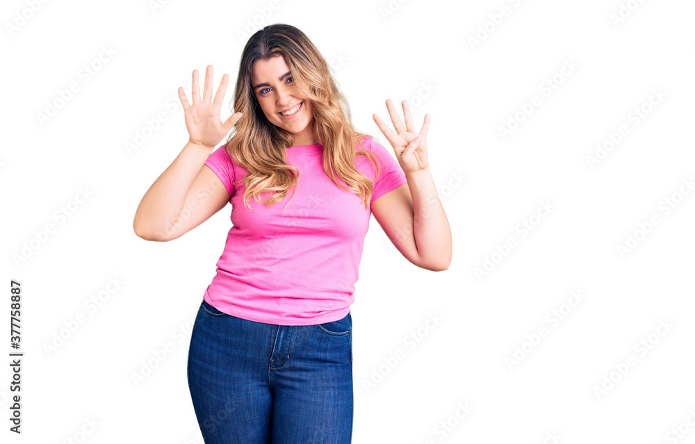 Young caucasian woman wearing sportswear showing and pointing up with fingers number nine while smiling confident and happy. Young caucasian woman wearing sportswear showing and pointing up with fingers number nine while smiling confident and happy.