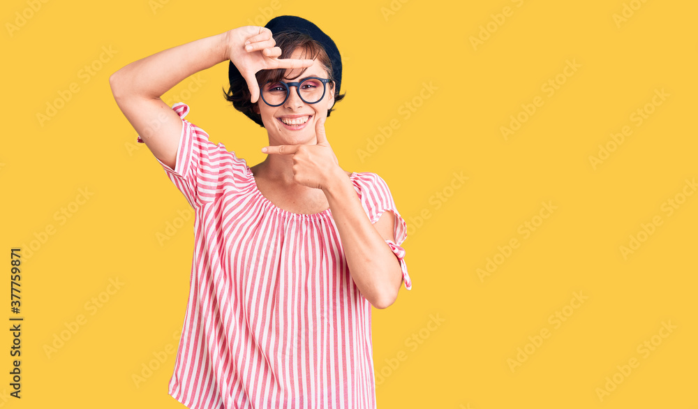 Beautiful young woman with short hair wearing casual clothes and glasses smiling making frame with hands and fingers with happy face. creativity and photography concept. Beautiful young woman with short hair wearing casual clothes and glasses smiling making frame with hands and fingers with happy face. creativity and photography concept.