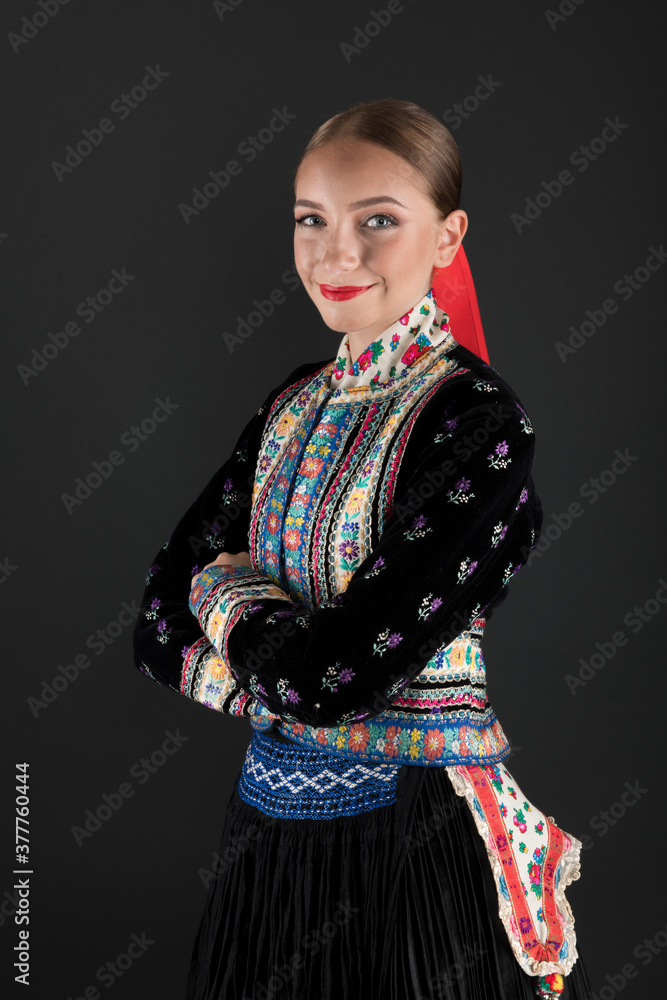 Beautiful woman wearing traditional Eastern Europe folk costumes. Slovak folk costumes. Beautiful woman wearing traditional Eastern Europe folk costumes. Slovak folk costumes.